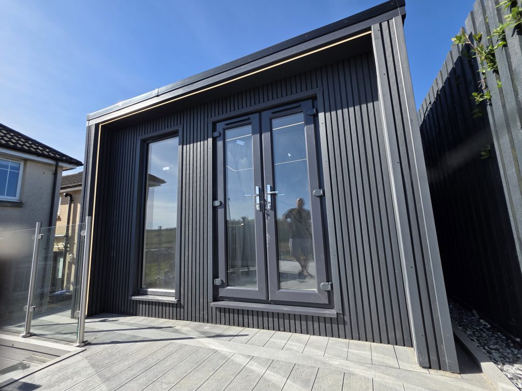 Black garden room doors and decking