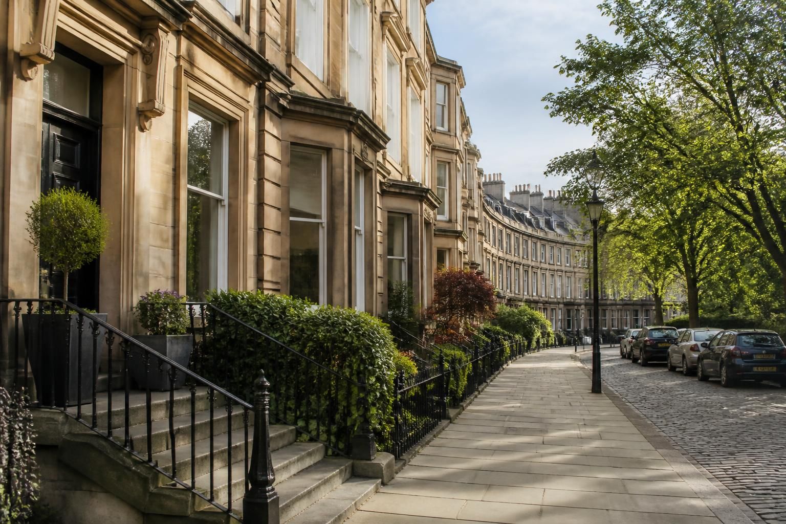 City neighborhood with sandstone terraces and a refined streetscape.